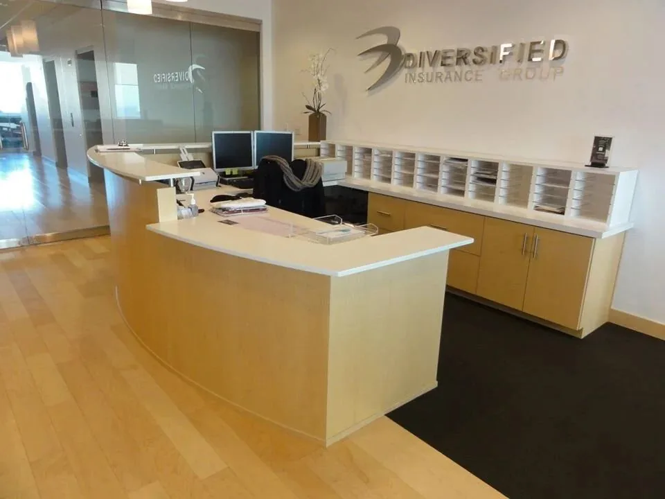 Commercial office reception desk and millwork built by Blue Spruce